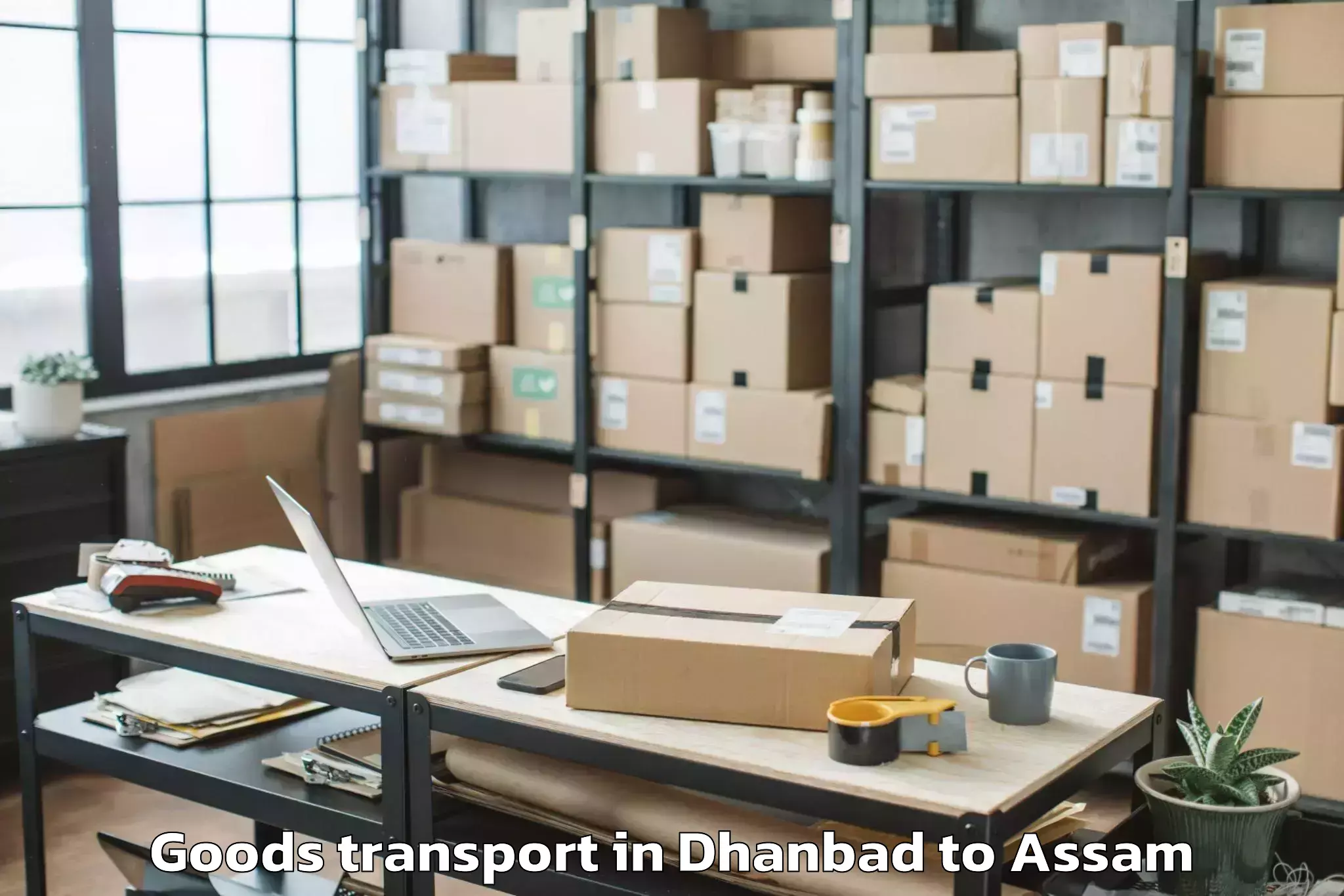 Dhanbad to Sarthebari Goods Transport Booking